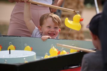 Child playing hook a duck